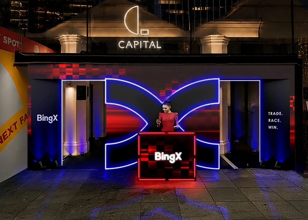 BingX entrance counter and illuminated branded backdrop — 3D design